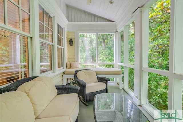 sunroom featuring vaulted ceiling