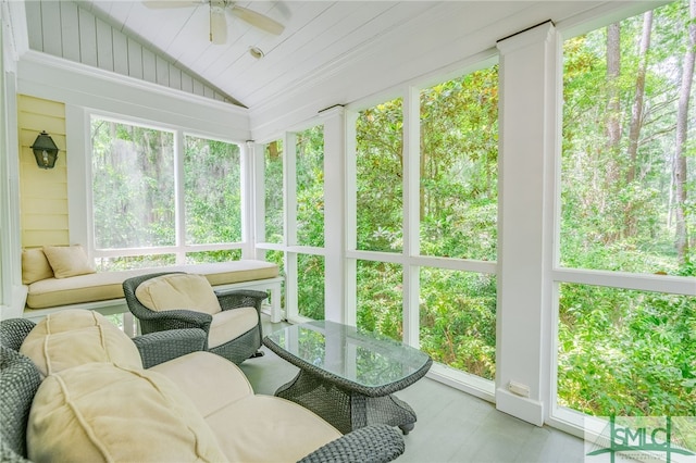 sunroom / solarium featuring lofted ceiling and ceiling fan