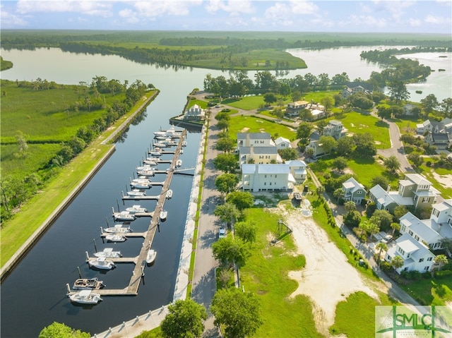 birds eye view of property with a water view