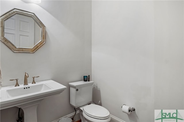 bathroom featuring toilet