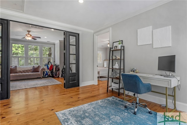 office featuring crown molding, ceiling fan, and light wood-type flooring