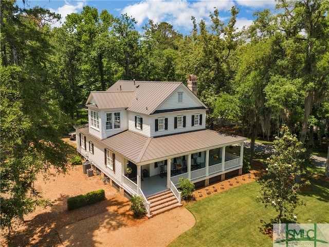 view of front facade featuring a front lawn and covered porch