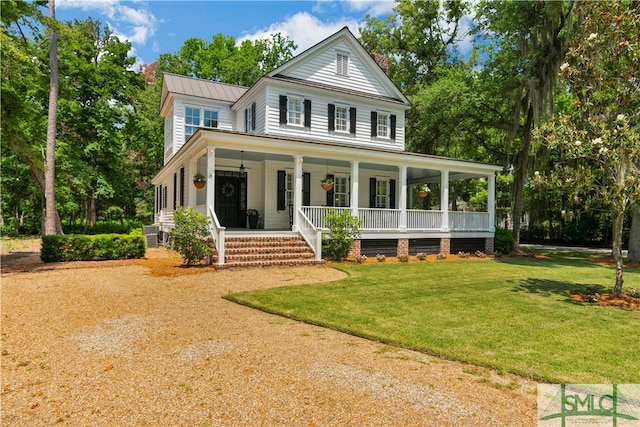 farmhouse-style home with a porch and a front lawn