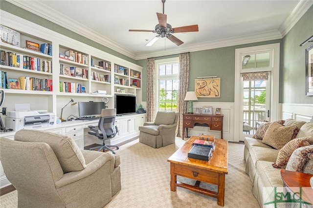 living room with ceiling fan, ornamental molding, and built in features