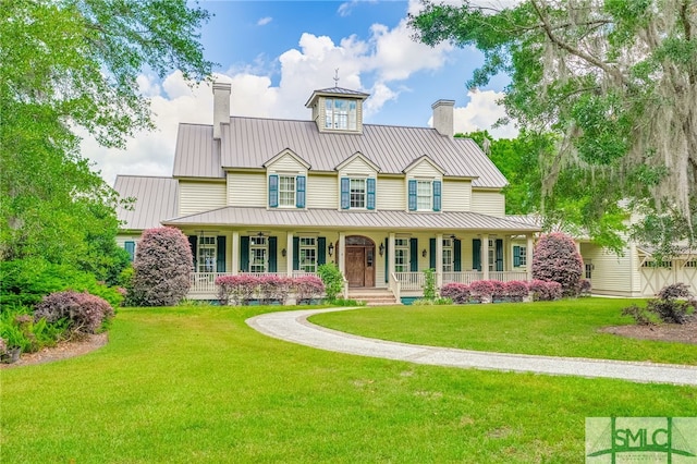 view of front of home with a front lawn and a porch