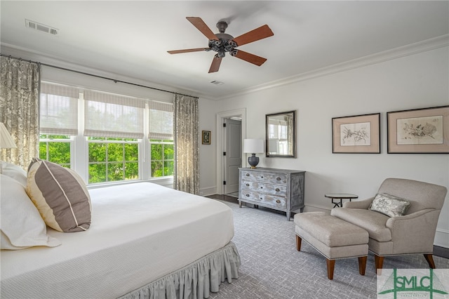 bedroom with carpet, ceiling fan, and ornamental molding