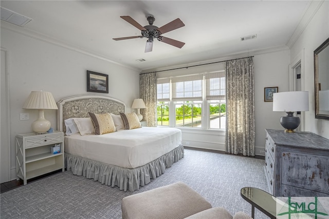 carpeted bedroom featuring ornamental molding and ceiling fan