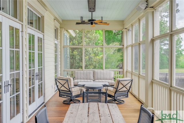 sunroom featuring french doors, plenty of natural light, and ceiling fan