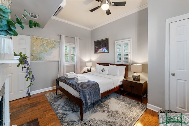 bedroom with hardwood / wood-style flooring, ornamental molding, and ceiling fan