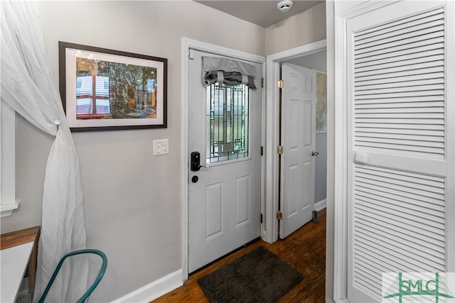 entryway with a healthy amount of sunlight and dark wood-type flooring