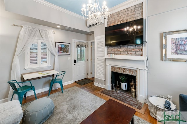 living room featuring a fireplace, a notable chandelier, and dark hardwood / wood-style flooring