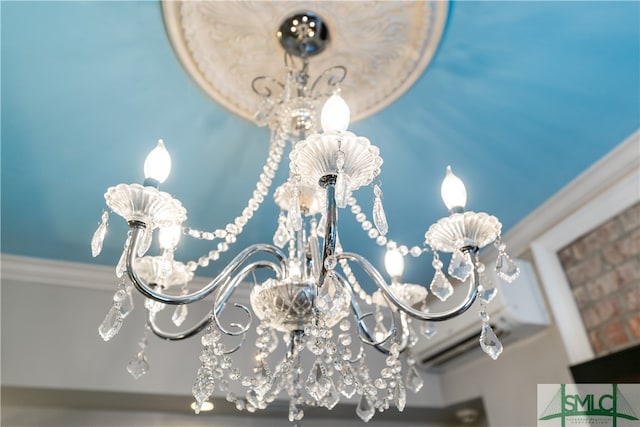 interior details featuring a chandelier and ornamental molding