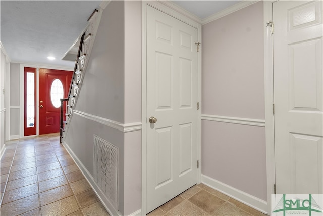 entrance foyer featuring ornamental molding