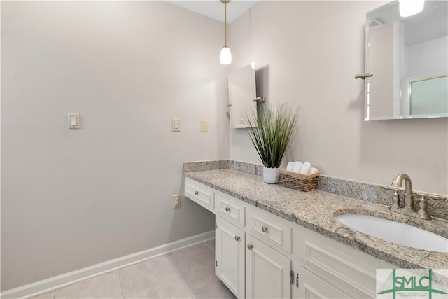 bathroom with tile patterned floors and vanity