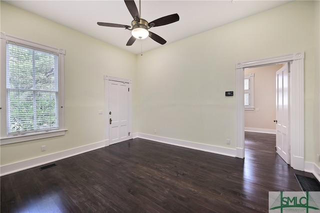 empty room featuring dark hardwood / wood-style floors and ceiling fan