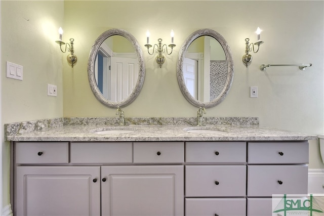 bathroom featuring double vanity