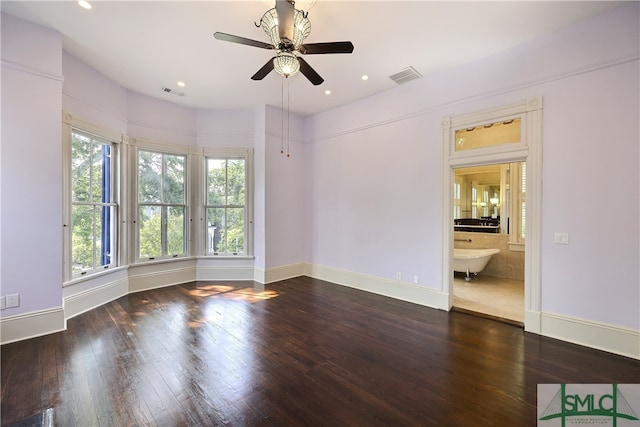 unfurnished room with dark hardwood / wood-style floors and ceiling fan