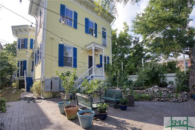 view of front of house with a patio area