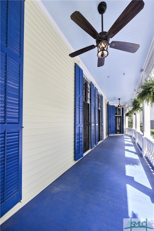 interior space with ceiling fan