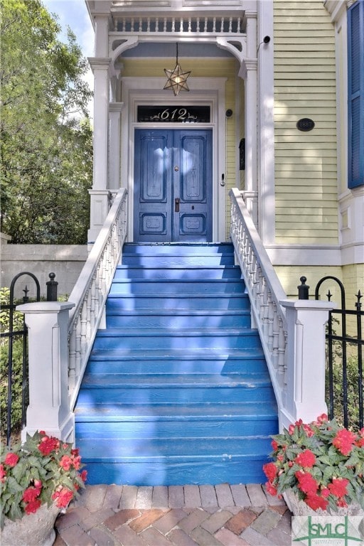 view of exterior entry with a porch