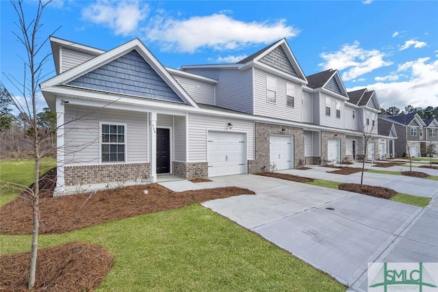 view of front of house featuring a front yard and a garage