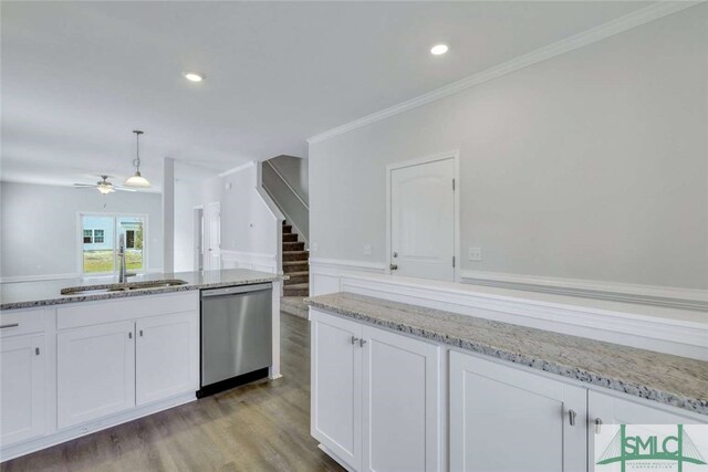 kitchen featuring wood-type flooring, sink, white cabinetry, and stainless steel dishwasher