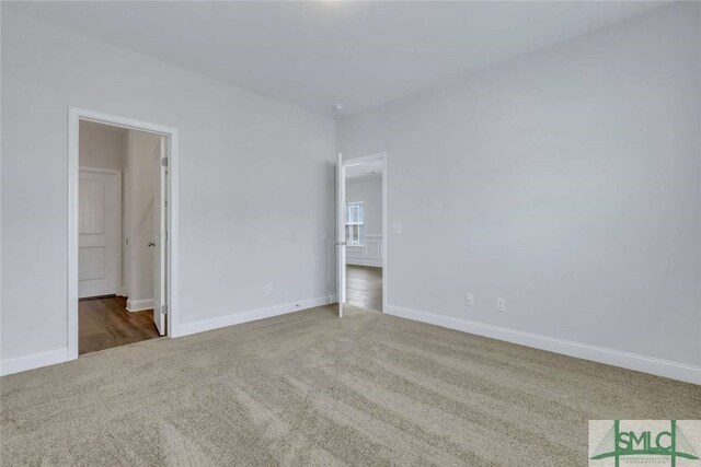 interior space with dark colored carpet