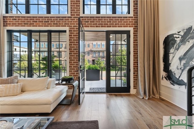 living room with plenty of natural light and hardwood / wood-style flooring