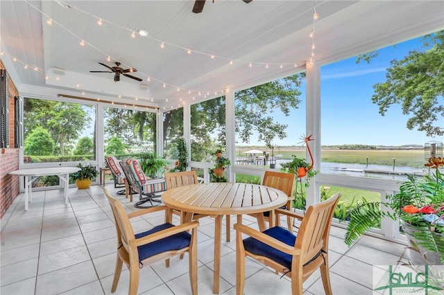 sunroom featuring ceiling fan