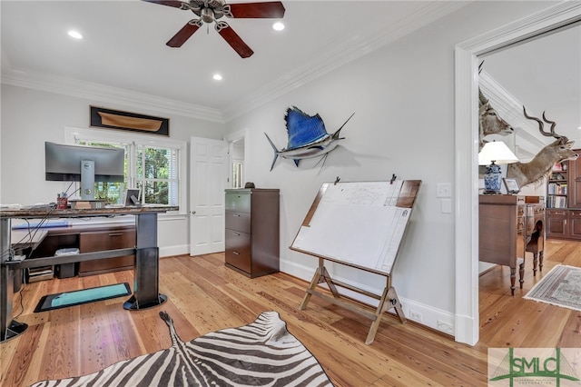 office with ceiling fan, crown molding, and light wood-type flooring