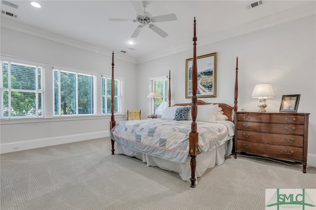 carpeted bedroom with ceiling fan and crown molding