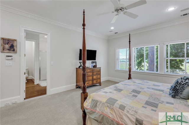 bedroom with carpet flooring, ensuite bathroom, ceiling fan, and crown molding