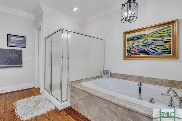 bathroom with ornamental molding, wood-type flooring, and shower with separate bathtub