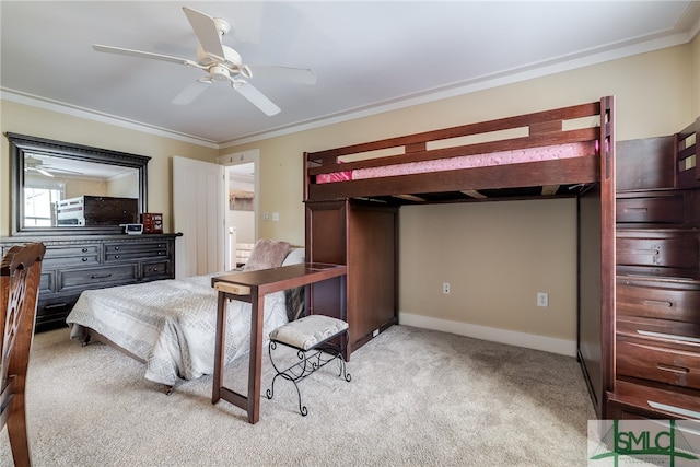 bedroom featuring light colored carpet, ornamental molding, and ceiling fan