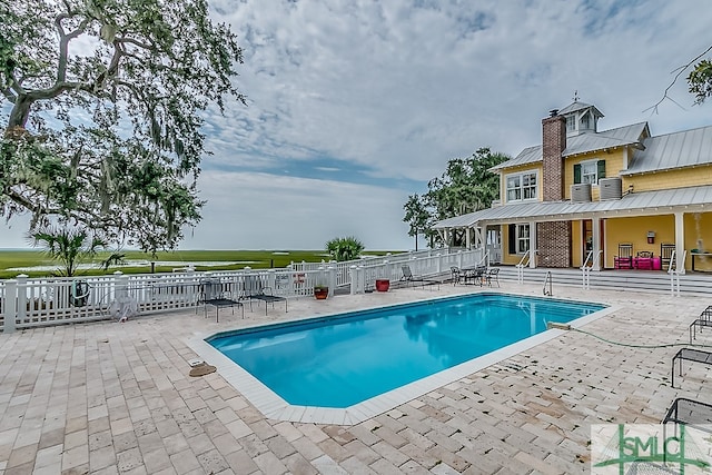 view of pool featuring a patio area