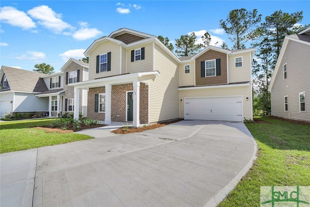 view of front of home featuring a front yard and a garage