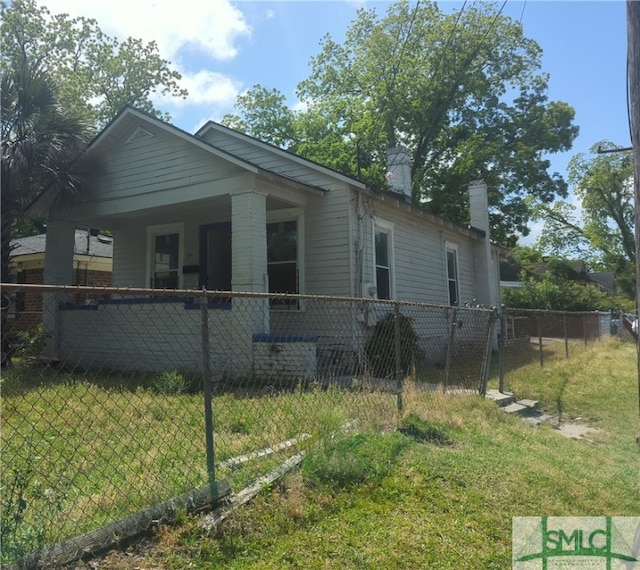 view of home's exterior with a lawn