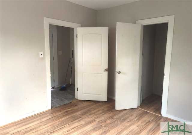 unfurnished bedroom featuring hardwood / wood-style floors