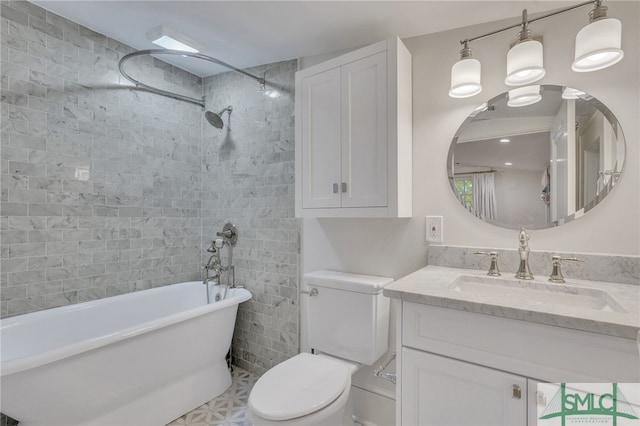 bathroom with tile patterned flooring, toilet, and vanity