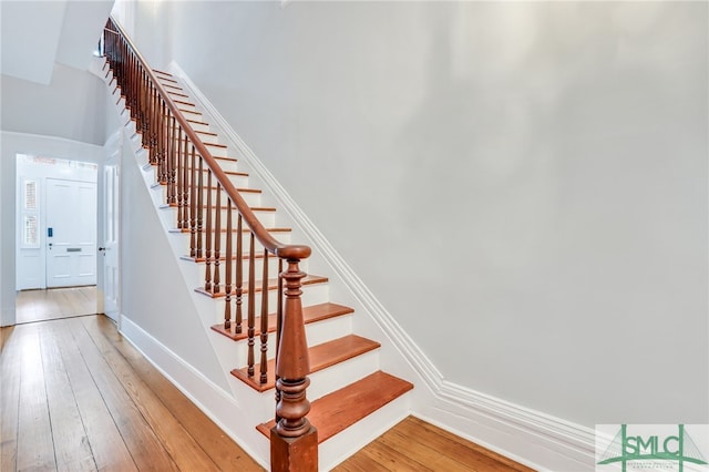 stairs featuring light hardwood / wood-style flooring