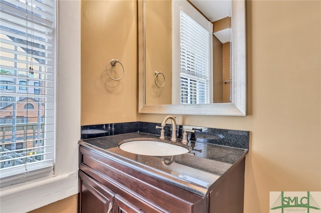 bathroom with a wealth of natural light and vanity