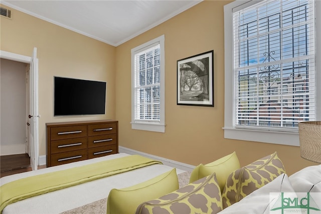 bedroom with ornamental molding