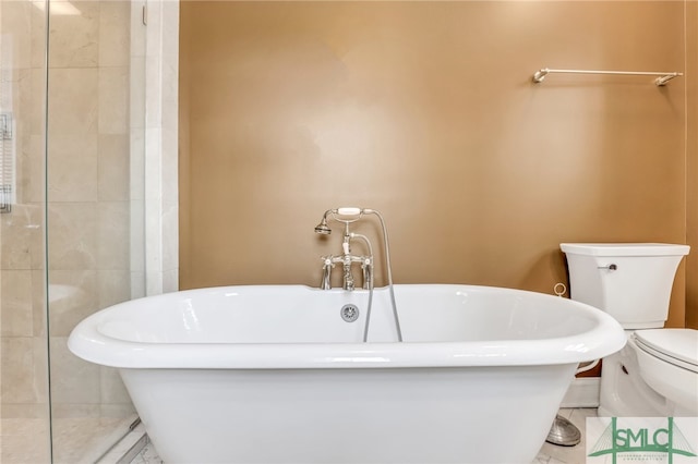 bathroom featuring a tub, tile flooring, and toilet