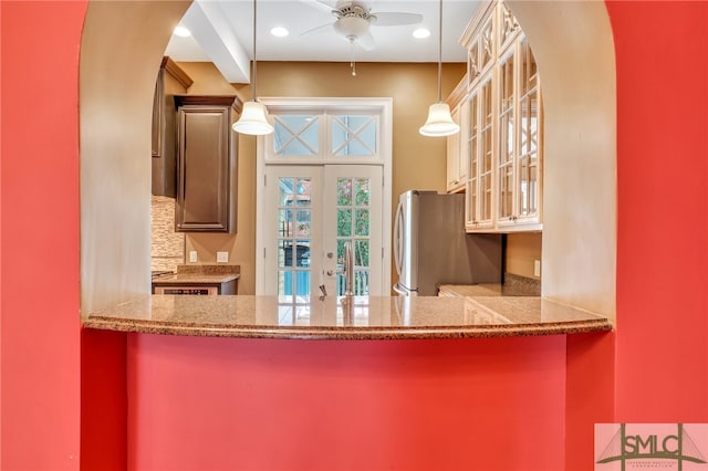 kitchen featuring french doors, stainless steel fridge, decorative light fixtures, backsplash, and ceiling fan