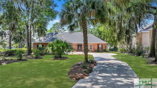 ranch-style house with a front yard