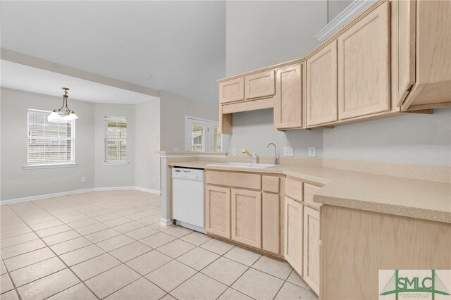 kitchen featuring light tile patterned floors, sink, light brown cabinets, and dishwasher