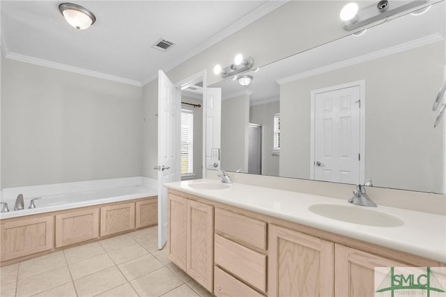 full bathroom featuring tile patterned flooring, a garden tub, ornamental molding, double vanity, and a sink