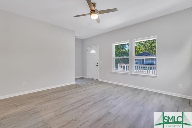 unfurnished room featuring ceiling fan and light hardwood / wood-style flooring