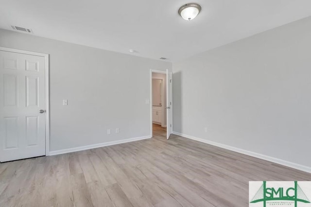 spare room featuring light hardwood / wood-style floors