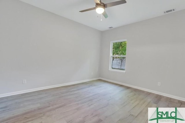 spare room featuring ceiling fan and light hardwood / wood-style flooring